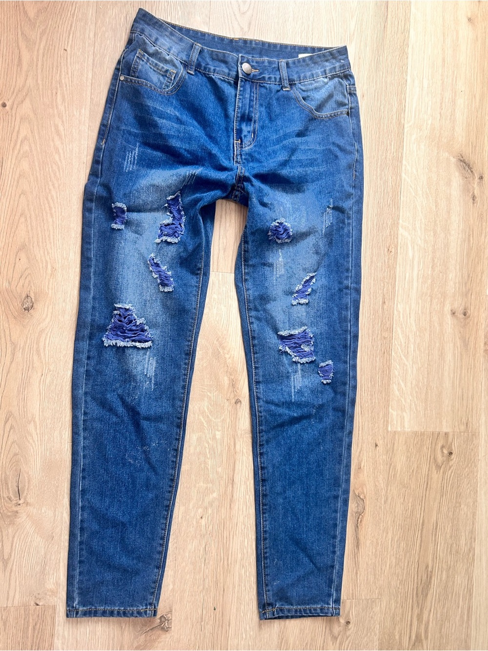 Distressed Blue Denim Jeans with Frayed Patchwork